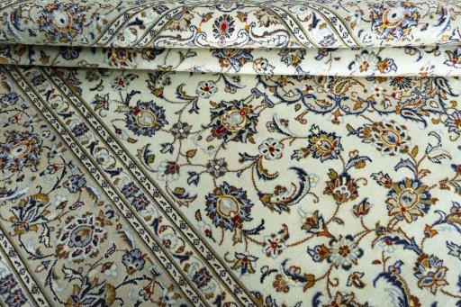 Close-up detail of 2000s Kashan rug from Iran / Persia showing Wool weave