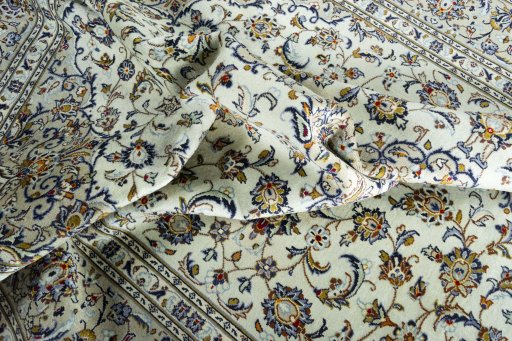 Surface texture of 2000s Kashan rug with natural Wool and intricate pattern