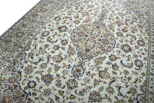 Backside of handmade 2000s Kashan rug showing knot structure and weave density