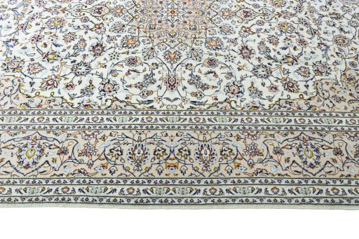 Corner detail of 2000s Kashan rug showing border pattern and Wool pile