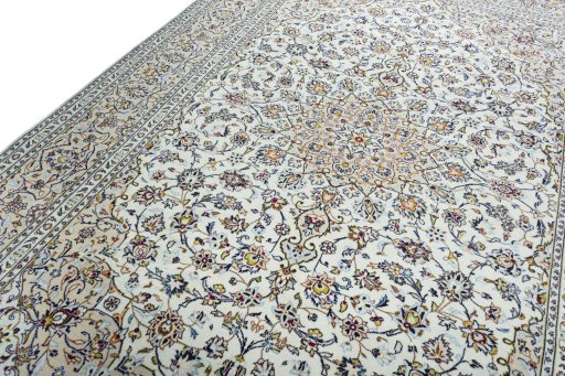 Backside of handmade 2000s Kashan rug showing knot structure and weave density