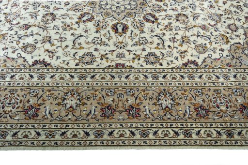 Corner detail of 2000s Kashan rug showing border pattern and Wool pile