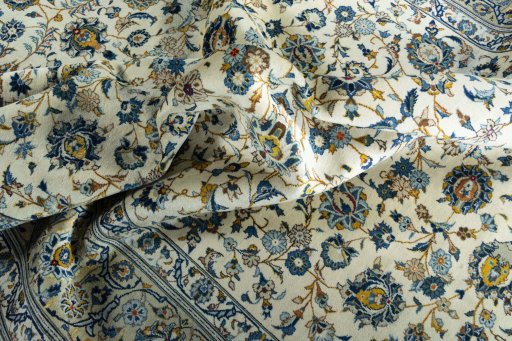 Surface texture of 2000s Kashan rug with natural Wool and intricate pattern