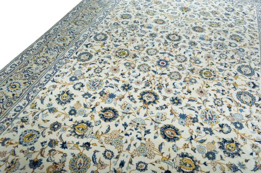 Backside of handmade 2000s Kashan rug showing knot structure and weave density