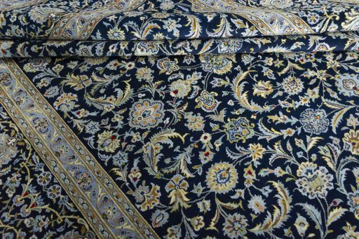 Close-up detail of 2000s Kashan rug from Iran / Persia showing Wool weave