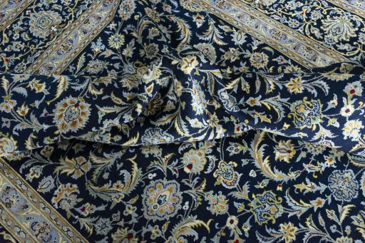 Surface texture of 2000s Kashan rug with natural Wool and intricate pattern