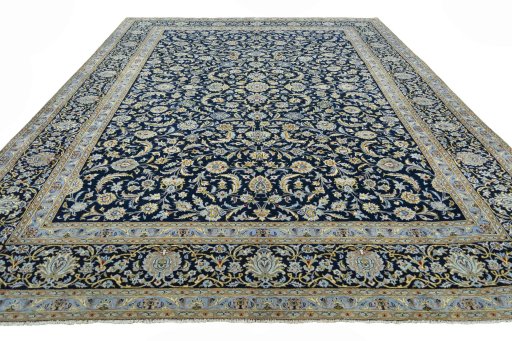 Surface texture of 2000s Kashan rug with natural Wool and intricate pattern