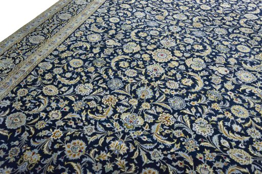 Backside of handmade 2000s Kashan rug showing knot structure and weave density