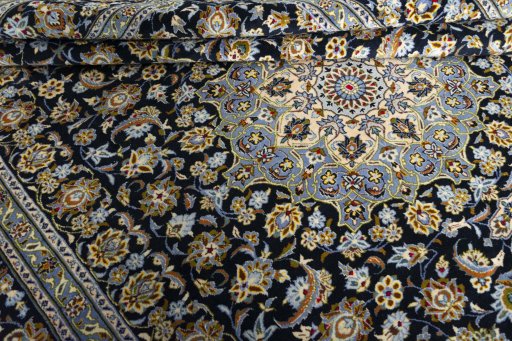 Close-up detail of 2000s Kashan rug from Iran / Persia showing Wool weave