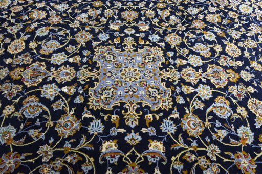 Corner detail of 2000s Kashan rug showing border pattern and Wool pile
