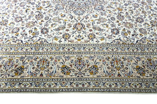 Corner detail of New Kashan rug showing border pattern and Wool pile