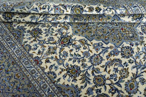 Close-up detail of 2000s Kashan rug from Iran / Persia showing Wool weave