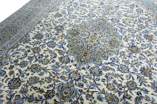 Backside of handmade 2000s Kashan rug showing knot structure and weave density