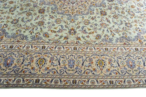 Corner detail of 2000s Kashan rug showing border pattern and Wool pile