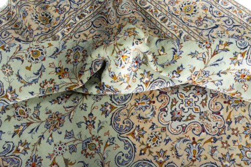 Surface texture of 2000s Kashan rug with natural Wool and intricate pattern