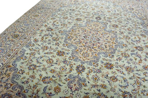 Backside of handmade 2000s Kashan rug showing knot structure and weave density
