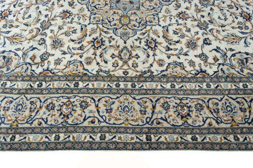 Corner detail of New Kashan rug showing border pattern and Wool pile