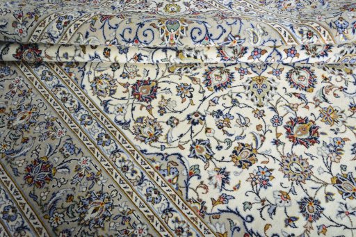 Close-up detail of 2000s Kashan rug from Iran / Persia showing Wool weave