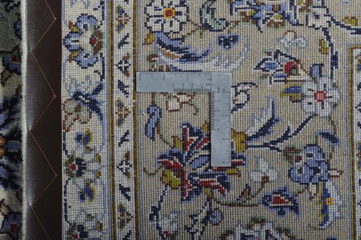 Backside of handmade 2000s Kashan rug showing knot structure and weave density