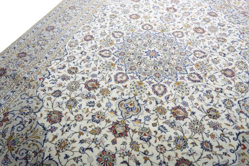 Backside of handmade 2000s Kashan rug showing knot structure and weave density