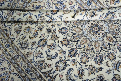 Close-up detail of 2000s Kashan rug from Iran / Persia showing Wool weave