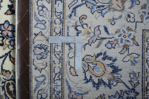 Backside of handmade 2000s Kashan rug showing knot structure and weave density