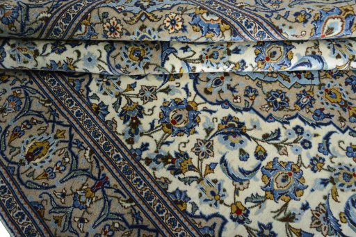 Surface texture of 2000s Kashan rug with natural Wool and intricate pattern