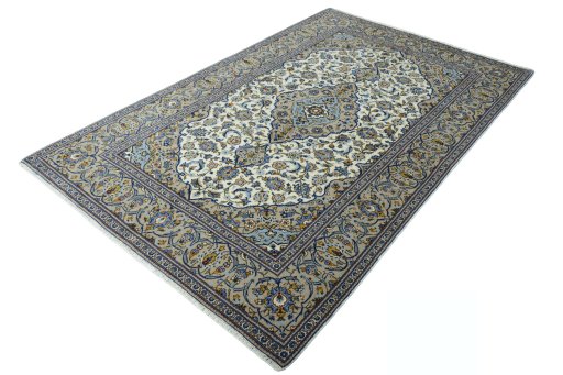 Corner detail of 2000s Kashan rug showing border pattern and Wool pile