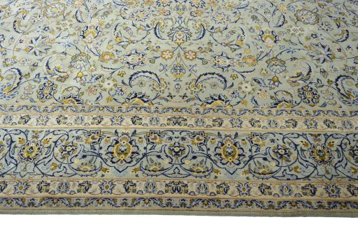 Corner detail of 2000s Kashan rug showing border pattern and Wool pile