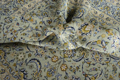 Surface texture of 2000s Kashan rug with natural Wool and intricate pattern