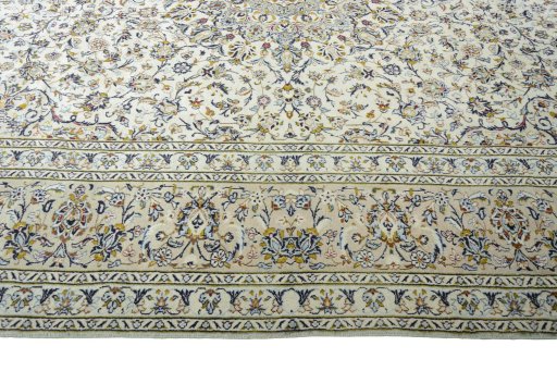 Corner detail of 2000s Kashan rug showing border pattern and Wool pile