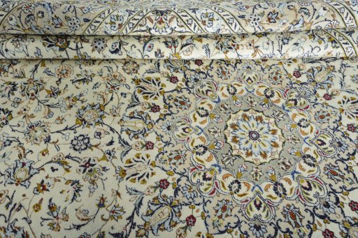 Close-up detail of 2000s Kashan rug from Iran / Persia showing Wool weave