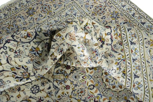 Surface texture of 2000s Kashan rug with natural Wool and intricate pattern