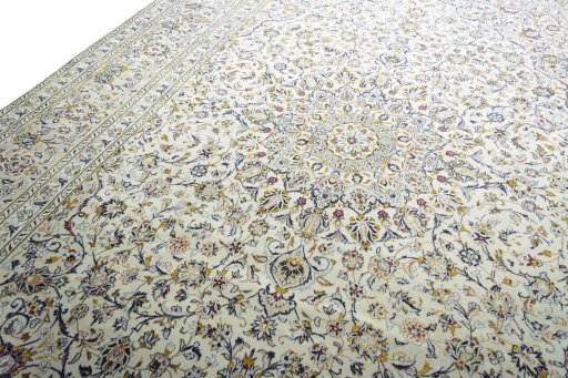 Backside of handmade 2000s Kashan rug showing knot structure and weave density