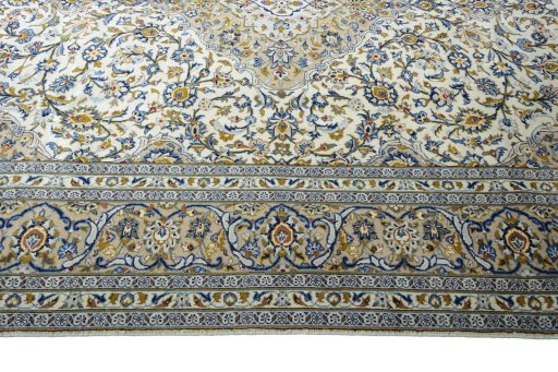 Corner detail of 2000s Kashan rug showing border pattern and Wool pile