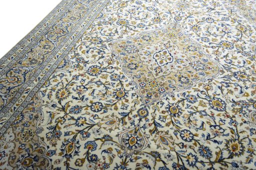 Backside of handmade 2000s Kashan rug showing knot structure and weave density