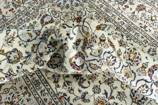 Surface texture of 2000s Kashan rug with natural Wool and intricate pattern
