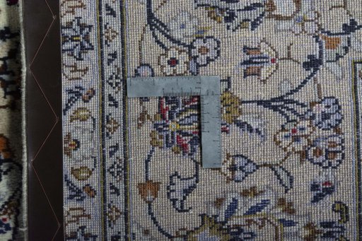 Backside of handmade 2000s Kashan rug showing knot structure and weave density