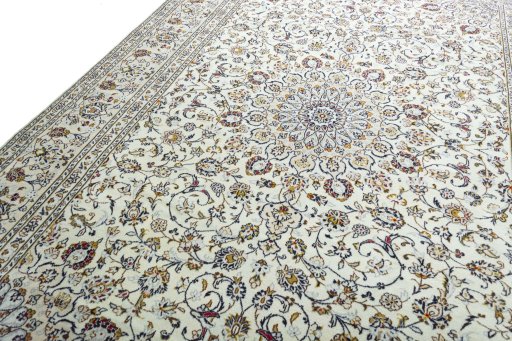 Backside of handmade 2000s Kashan rug showing knot structure and weave density