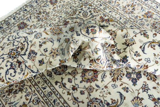 Surface texture of 2000s Kashan rug with natural Wool and intricate pattern
