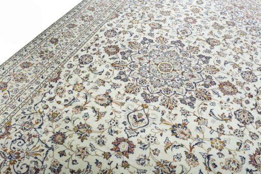 Backside of handmade 2000s Kashan rug showing knot structure and weave density