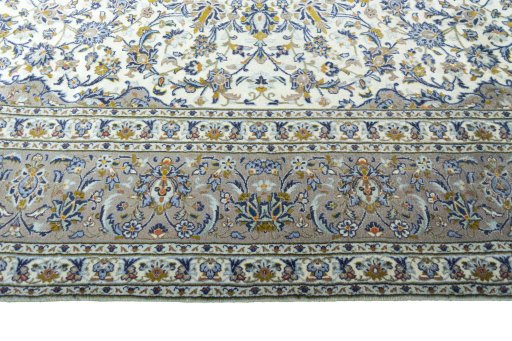 Corner detail of 2000s Kashan rug showing border pattern and Wool pile