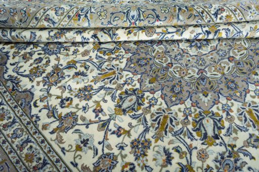 Close-up detail of 2000s Kashan rug from Iran / Persia showing Wool weave