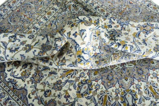 Surface texture of 2000s Kashan rug with natural Wool and intricate pattern