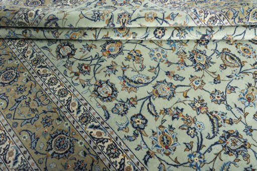Close-up detail of 2000s Kashan rug from Iran / Persia showing Wool weave