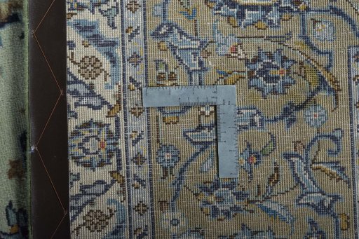 Backside of handmade 2000s Kashan rug showing knot structure and weave density