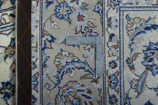 Backside of handmade 2000s Kashan rug showing knot structure and weave density