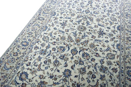 Backside of handmade 2000s Kashan rug showing knot structure and weave density