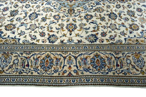 Corner detail of New Kashan rug showing border pattern and Wool pile