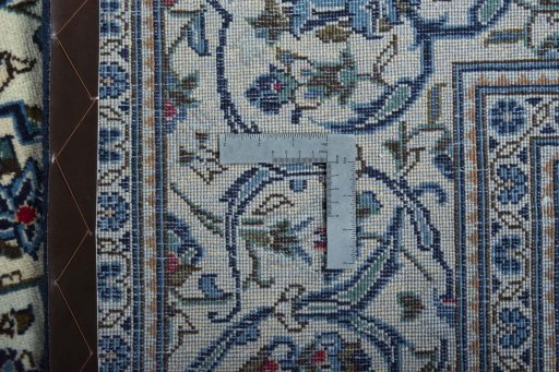 Surface texture of 2000s Kashan rug with natural Wool and intricate pattern